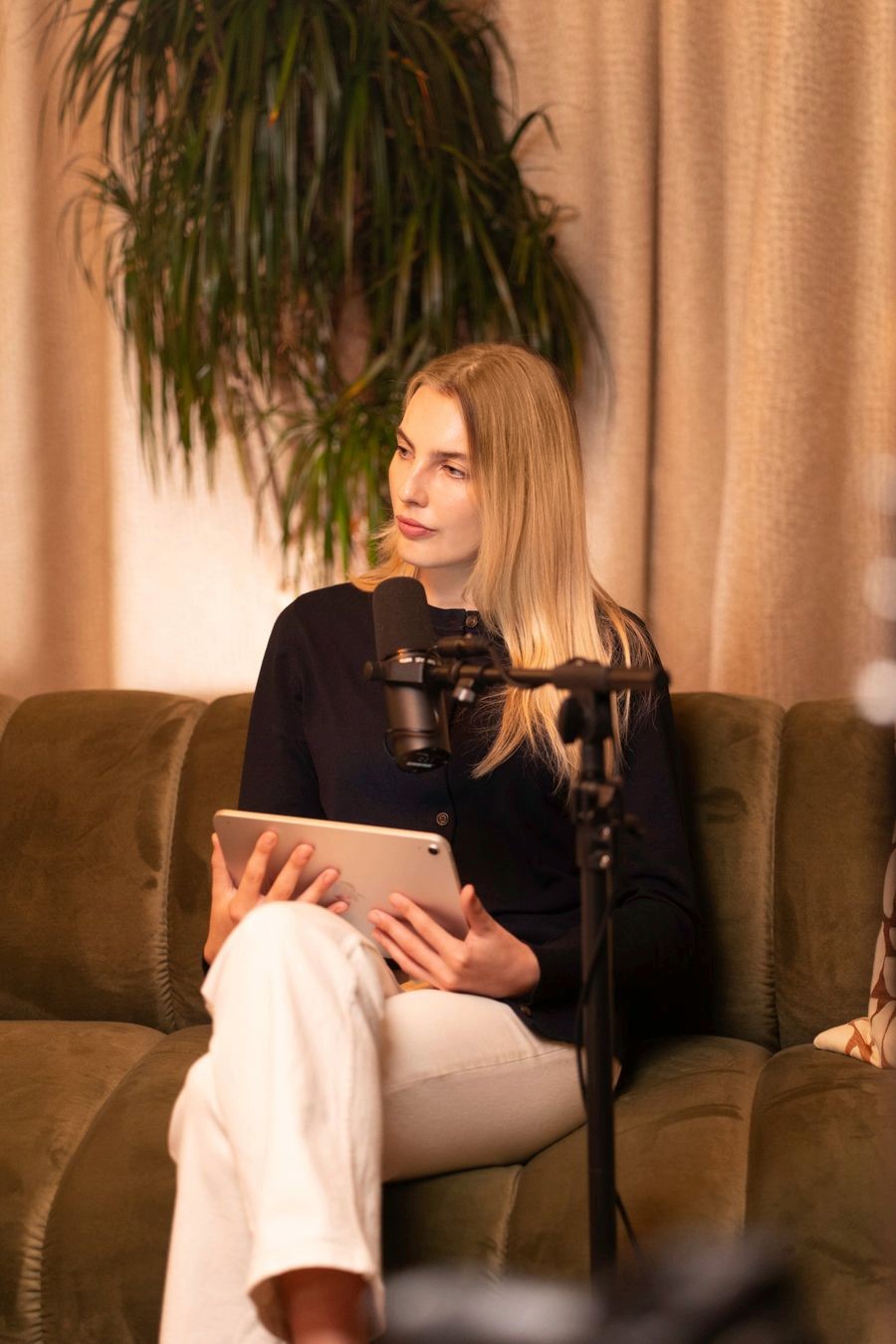 Isi, freelance social media manager in Manchester, recording a podcast